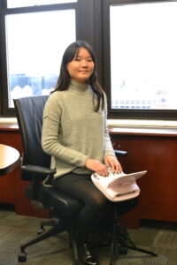 Hana in one of the conference rooms of her new office